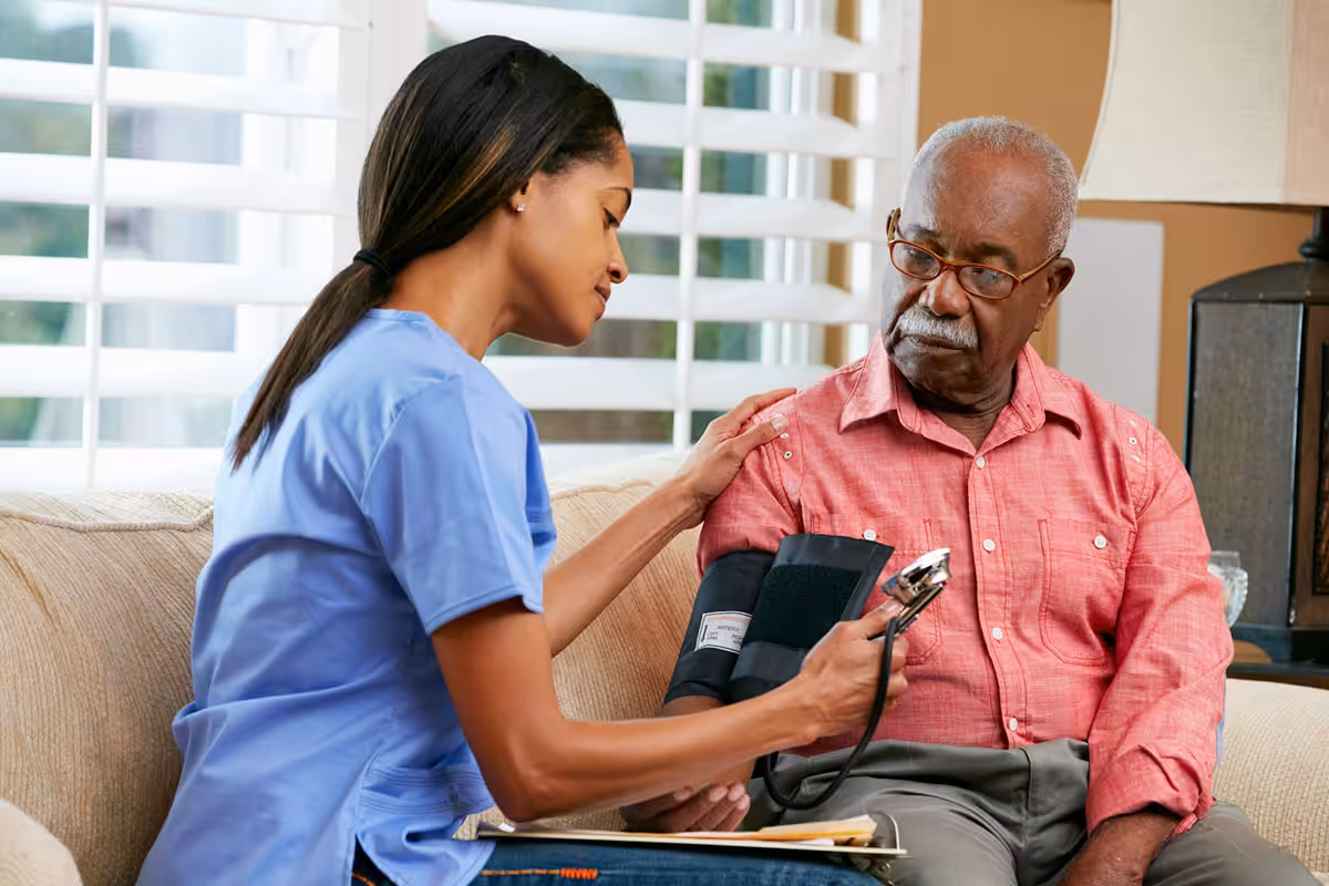 Registered nurse providing in-home health monitoring for retired Alberta educator under extended health benefits